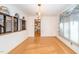 Dining room with cork flooring, arched openings, and a view into the kitchen at 4921 Larchmont Dr, Raleigh, NC 27612