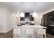 Kitchen with island, granite countertops, and stainless steel appliances at 502 Hester Rd, Durham, NC 27703