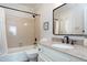 Clean bathroom with a tub shower combo and granite countertop vanity at 115 Clancy Cir, Cary, NC 27511