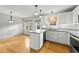 White kitchen features granite countertops and stainless steel appliances at 116 Drew Ct, Clayton, NC 27520