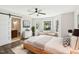 Main bedroom with ensuite bathroom, ceiling fan, and stylish furnishings at 121 Candlewick Dr, Wendell, NC 27591