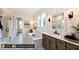 Spa-like bathroom with soaking tub, patterned wallpaper, and frameless shower at 122 Preston Trce, Pittsboro, NC 27312