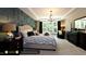 Spacious main bedroom with an accent wall and large windows at 259 August Trce Dr, Pittsboro, NC 27312