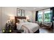 Guest suite with a queen-size bed, hardwood floors, and ample natural light at 259 August Trce Dr, Pittsboro, NC 27312