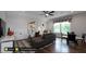 Bright bonus room featuring hardwood floors, a comfortable seating area, and a game table at 259 August Trce Dr, Pittsboro, NC 27312