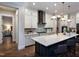 Modern kitchen with white cabinets, quartz countertops, and a large island at 259 August Trce Dr, Pittsboro, NC 27312