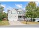 Two-story house with solar panels, double garage, and landscaped yard at 1308 Fenwick Pkwy, Durham, NC 27713