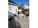 Back patio with stamped concrete, white patio furniture, and a grill at 150 Water Oak Dr, Smithfield, NC 27577