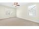 Bedroom featuring plush carpet and windows that fill the room with natural light at 2057 Tordelo Pl Pl, Apex, NC 27502