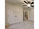 Spacious bedroom with double closet and ceiling fan at 2416 Laurelford Ln, Wake Forest, NC 27587