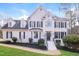 All-brick two-story house with a white exterior, black shutters, and a landscaped yard at 2416 Laurelford Ln, Wake Forest, NC 27587