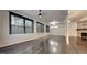 Living room with dark hardwood floors, large windows, and a fireplace at 2416 Laurelford Ln, Wake Forest, NC 27587