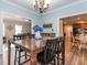 Elegant dining room with chandelier and hardwood floors at 347 Manchester Trl, Clayton, NC 27527