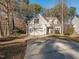 Two-story house with beige siding, a two-car garage, and a landscaped yard at 347 Manchester Trl, Clayton, NC 27527