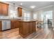 Kitchen with island, hardwood floors, and breakfast nook at 347 Manchester Trl, Clayton, NC 27527