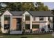 Stunning two-story home with a modern design and metal roof at 4139 Rockingham Dr, Raleigh, NC 27609