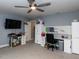 Bonus room includes TV, work space, and ample closet space at 415 Brazil Nut Ln, Smithfield, NC 27577