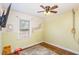 Simple bedroom with light yellow walls and hardwood floors at 436 Carolina Ave, Rocky Mount, NC 27801