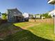 Large backyard with grassy area and privacy fence at 5012 Centerbud Pl, Raleigh, NC 27606