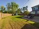 Backyard with shed, patio, firepit and grassy area at 5012 Centerbud Pl, Raleigh, NC 27606