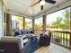 Relaxing screened porch with comfortable seating and ceiling fan at 5012 Centerbud Pl, Raleigh, NC 27606