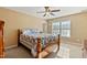 Cozy bedroom with wooden bed frame and ceiling fan at 5801 Flat Fern Dr, Raleigh, NC 27610