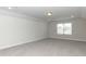 Large, empty bedroom with neutral decor at 596 Ravensworth Dr, Garner, NC 27529