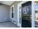 Inviting front entrance with black door and stone accents at 596 Ravensworth Dr, Garner, NC 27529