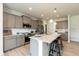 Modern kitchen with island, stainless steel appliances, and granite countertops at 596 Ravensworth Dr, Garner, NC 27529