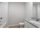 Simple bathroom with white vanity, granite countertop, and shower/tub combo at 604 Rhino Bnd, Oxford, NC 27565