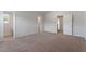Large main bedroom with plush carpet, ensuite bathroom access, and ample natural light at 604 Rhino Bnd, Oxford, NC 27565