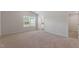 Spacious main bedroom with vaulted ceilings, plush carpet, an ensuite bathroom, and a walk-in closet at 604 Rhino Bnd, Oxford, NC 27565