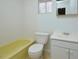 Clean bathroom with yellow bathtub, toilet and vanity at 130 S Estes Dr # G5, Chapel Hill, NC 27514