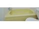 Yellow bathtub with tiled surround at 130 S Estes Dr # G5, Chapel Hill, NC 27514