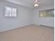 Bright bedroom with carpet, ceiling fan, and large windows at 130 S Estes Dr # G5, Chapel Hill, NC 27514
