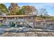 Brick building exterior with parking and a stairway at 130 S Estes Dr # G5, Chapel Hill, NC 27514