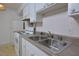 Clean kitchen featuring a double sink and stove at 130 S Estes Dr # G5, Chapel Hill, NC 27514
