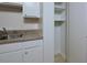 Kitchen area with white cabinets and pantry at 130 S Estes Dr # G5, Chapel Hill, NC 27514