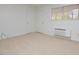 Bright living room featuring carpet and a door at 130 S Estes Dr # G5, Chapel Hill, NC 27514