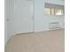 Simple living room with carpet, door, and window at 130 S Estes Dr # G5, Chapel Hill, NC 27514