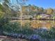 Houses on a peaceful waterfront with lush trees at 130 S Estes Dr # G5, Chapel Hill, NC 27514