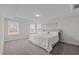 Large main bedroom with carpeted floor and windows at 1598 Wareham Dr, Mebane, NC 27302