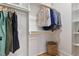 Walk-in closet with shelving and hanging rods at 2222 Woodrow St, Durham, NC 27705