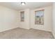 Bright bedroom with carpet flooring and two windows at 226 Begen St, Morrisville, NC 27560