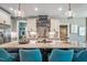 Modern kitchen island with granite countertop and teal barstools at 269 Ivy Ridge Rd, Chapel Hill, NC 27516