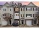 Beige and brown three-story townhouse with attached garage at 2765 Wyntercrest Ln, Durham, NC 27713