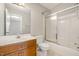 Clean bathroom with a shower/tub combo and wood vanity at 28 Park Place Street St, Angier, NC 27501