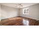 Bright bedroom with hardwood floors and a large window at 28 Park Place Street St, Angier, NC 27501