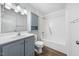 Clean bathroom with light grey vanity and a shower/tub combo at 312 Burkwood Ln, Raleigh, NC 27609