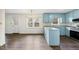 Kitchen with light blue cabinets, stainless steel appliances and an adjacent dining area at 312 Burkwood Ln, Raleigh, NC 27609